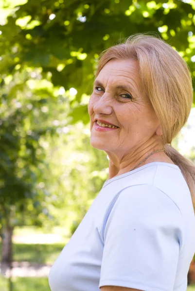 stock image Old woman in park