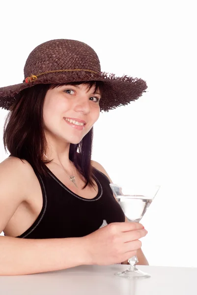 Girl in hat drinks — Zdjęcie stockowe