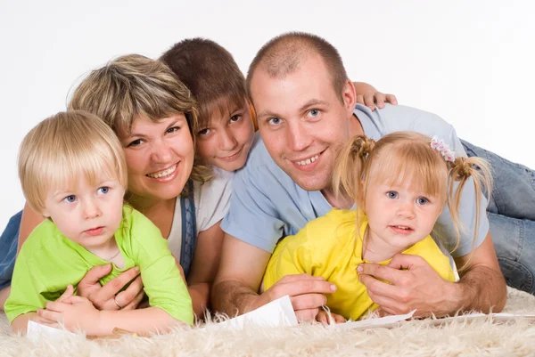 Family on carpet Stock Image