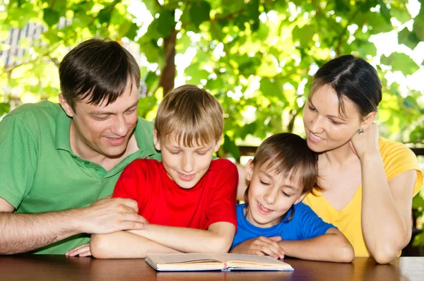Beautiful family reading — Stock Photo, Image