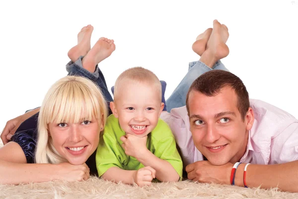 Familjen på en matta — Stockfoto