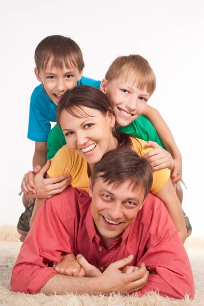 Family on carpet — Stock Photo, Image