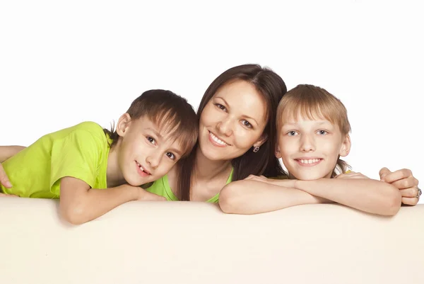 Mom with sons at sofa — Stock Photo, Image