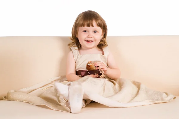 Little girl on sofa — Stock Photo, Image