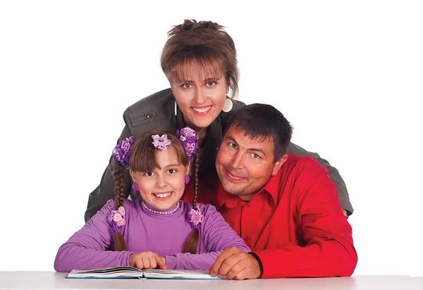 Daughter reads with parents — Stock Photo, Image