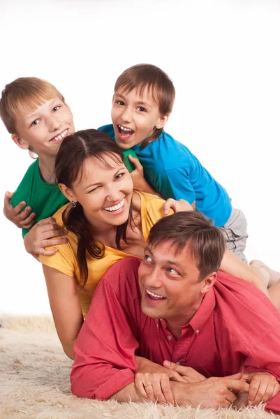 Family on carpet Stock Image