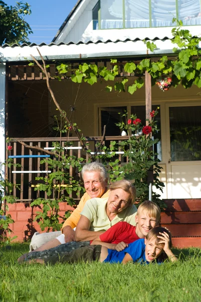 Grandsons with grandparents playing — Stock Photo, Image