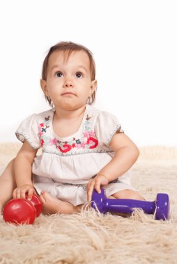 Girl playing on carpet clipart