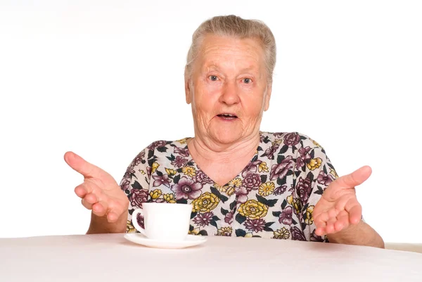 Granny at table — Stock Photo, Image