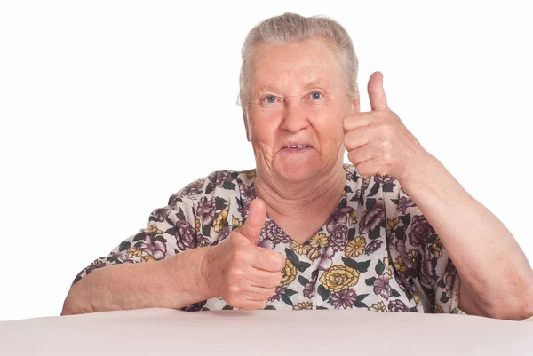 Feliz abuela en la mesa —  Fotos de Stock