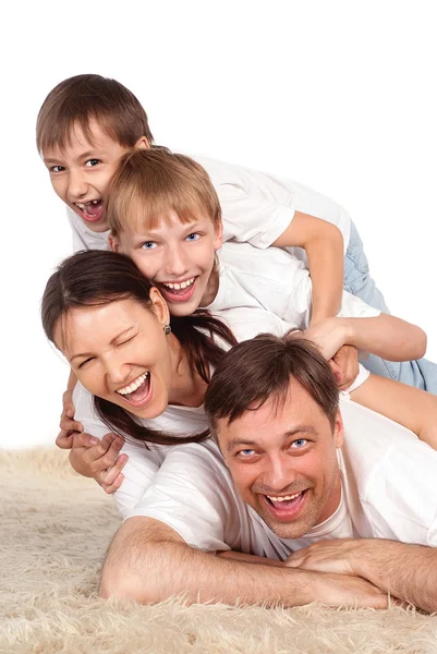 Rodina na koberci — Stock fotografie