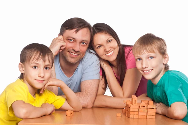 Cute family playing at table — Stock Photo, Image