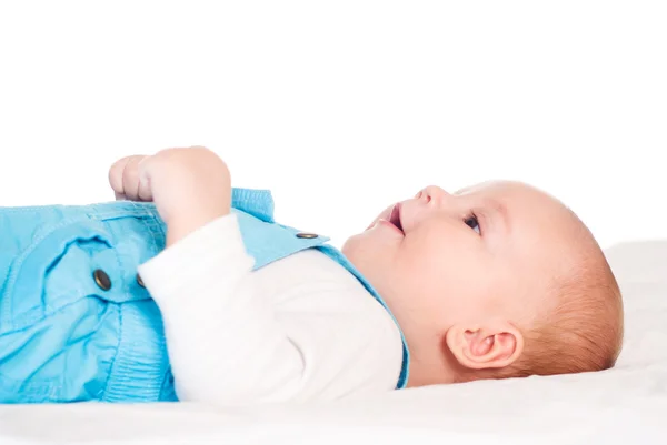 Baby lies on bed — Stock Photo, Image