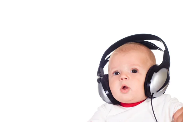 Baby listens to music — Stock Photo, Image