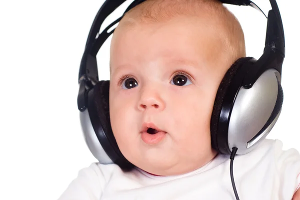 Baby listens to music — Stock Photo, Image