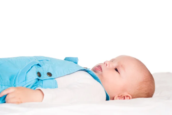 Bebé se acuesta en la cama —  Fotos de Stock