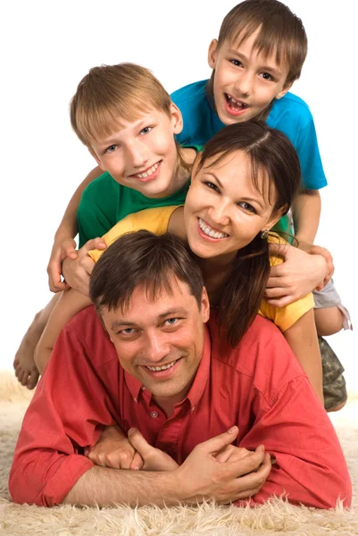Familie auf einem Teppich — Stockfoto
