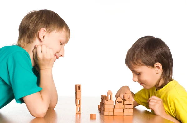 Two brothers playing at the table — Stock Photo, Image
