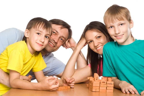 Familia feliz jugando en la mesa —  Fotos de Stock