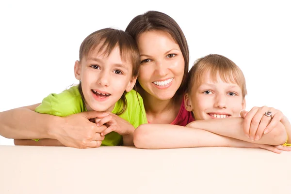 Mom with kids on sofa — Stock Photo, Image