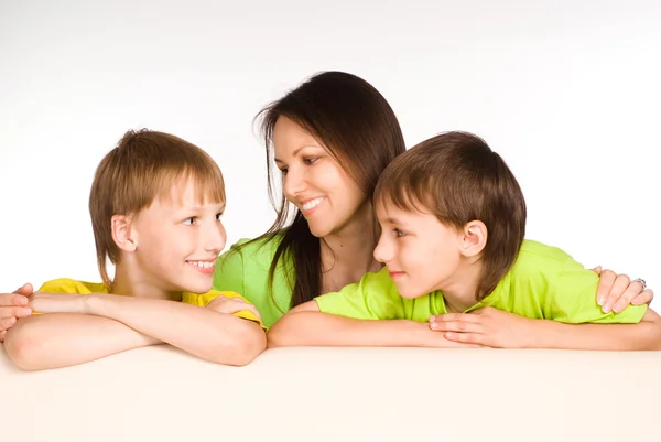 Mom with kids on sofa — Stock Photo, Image
