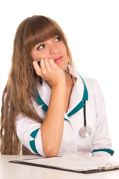 Schattig verpleegster aan tafel — Stockfoto