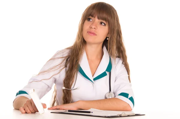 Sjuksköterska vid bord — Stockfoto