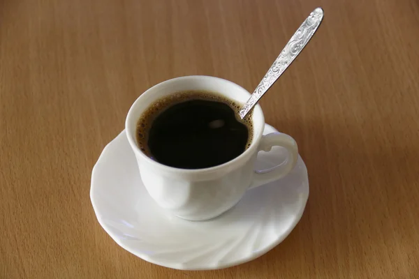 Cup of coffee in office — Stock Photo, Image