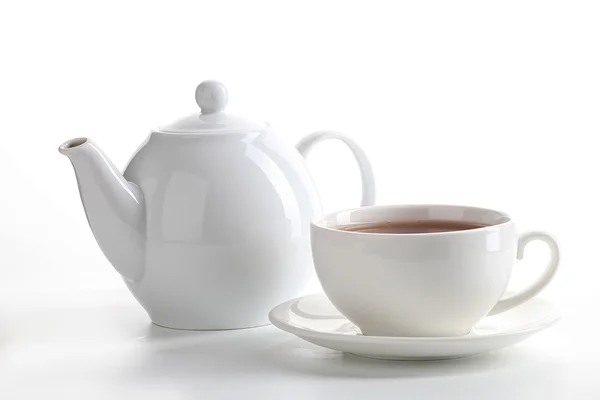 stock image Cup of tea with teapot