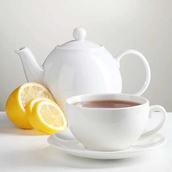 stock image Cup of tea with teapot