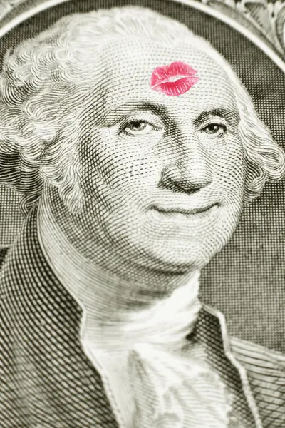 Beijo de batom em uma nota de dólar Fotografia De Stock