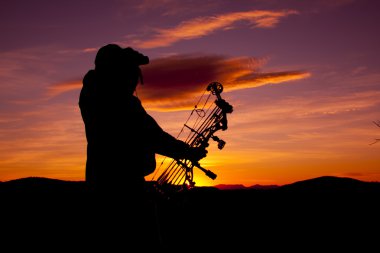 Bowhunter Glassing at Sunset clipart