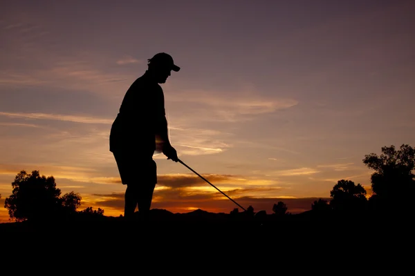 Golfista při západu slunce — Stock fotografie