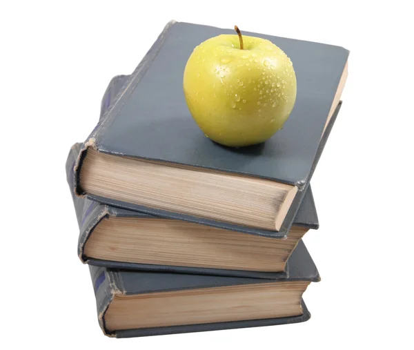Livros velhos com uma maçã — Fotografia de Stock