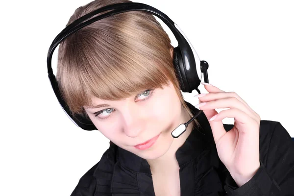 stock image The young beautiful girl in ear-phones with a microphone