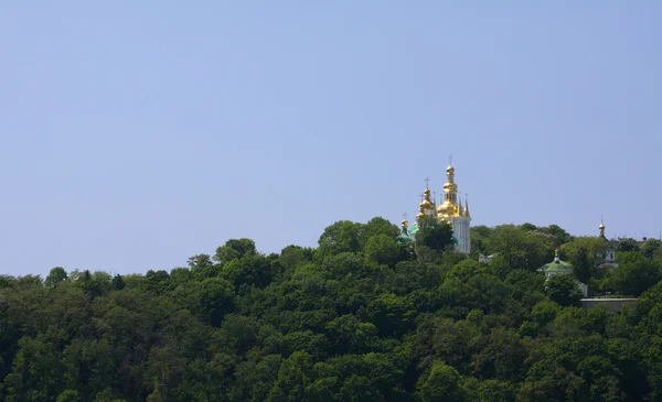 Christian orthodox church on a green hill — Stock Photo, Image