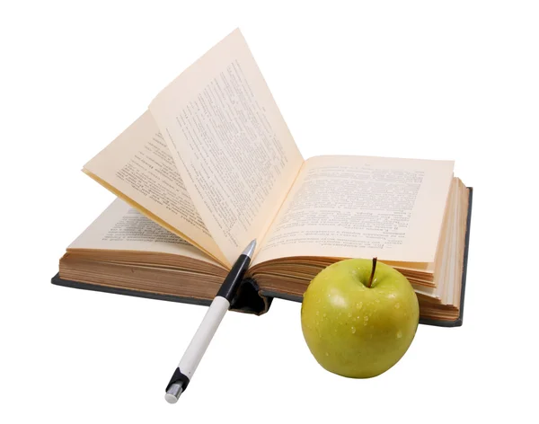 A régi könyv, egy tollat és egy apple Stock Kép