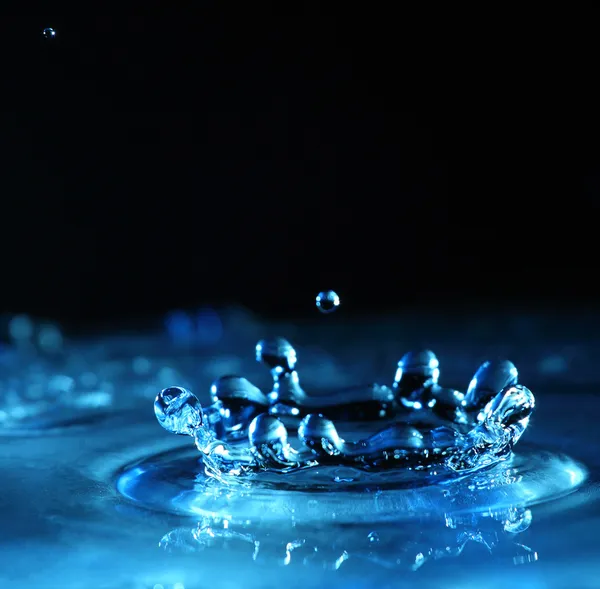 Брызги воды голубого цвета Стоковое Фото