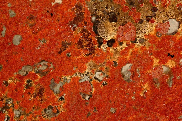 Bright red rusting metal plate — Stock Photo, Image