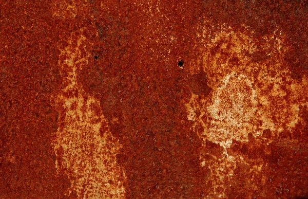 Rouille rouge tachetée et à motifs sur une feuille de métal — Photo