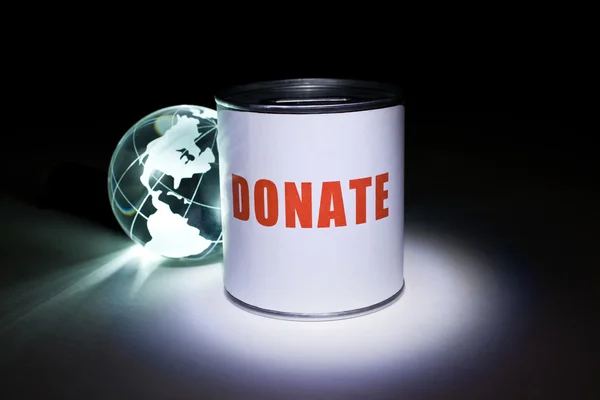 Világon, és adományozás doboz — Stock Fotó