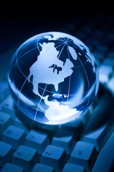 Globe and Computer Keyboard Royalty Free Stock Images