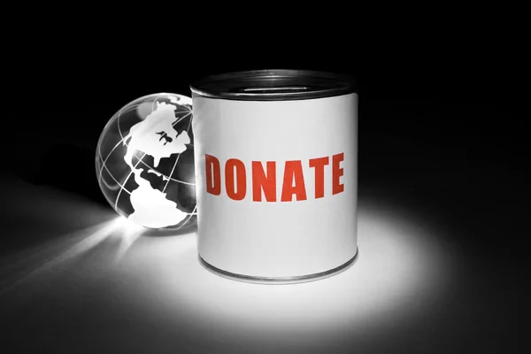 Globe en donatie vak — Stockfoto