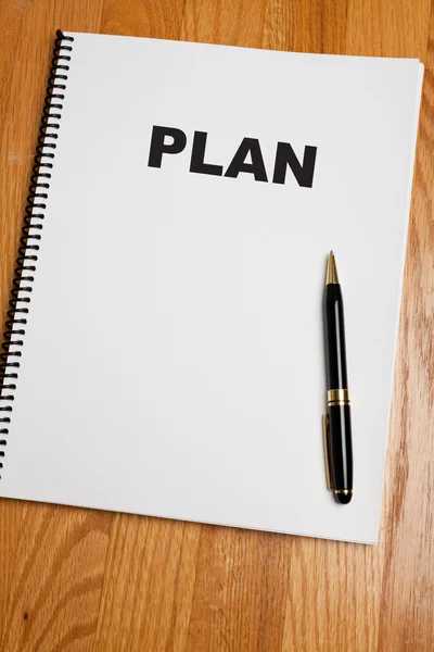 План и ручка — стоковое фото