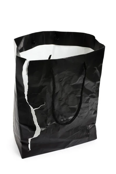 引き裂かれた黒いショッピング バッグ — ストック写真