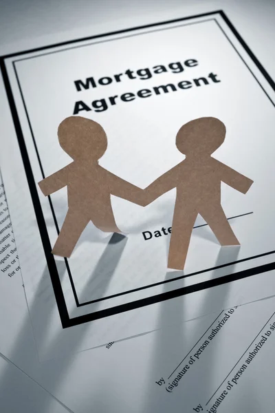 Mortgage Agreement and Paper Chain Men — Stock Photo, Image