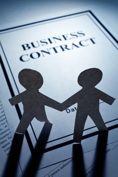 Business Contract and Paper Chain Men — Stock Photo, Image