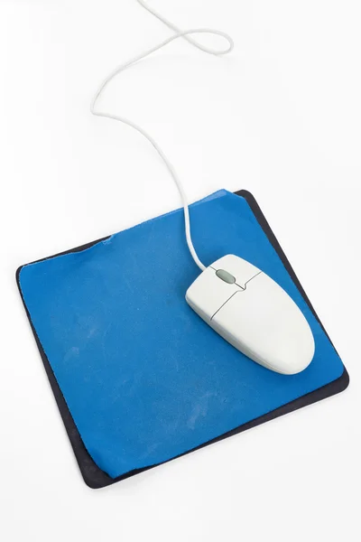 Computer mouse e vecchio tappetino del mouse — Foto Stock