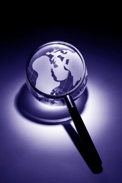 Globe and Magnifying Glass — Stock Photo, Image