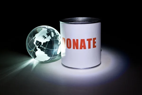 Globus und Spendenbox — Stockfoto
